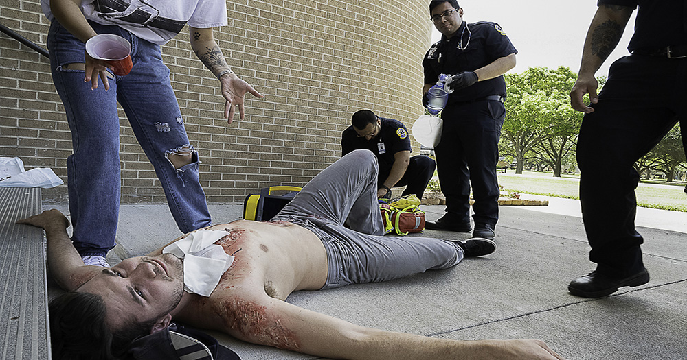 EMS students working on a patient scenario